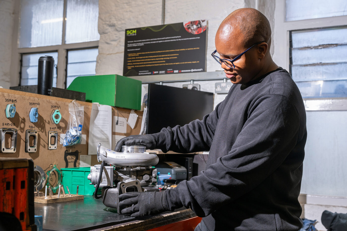 SCM Turbo technician working on a turbocharger